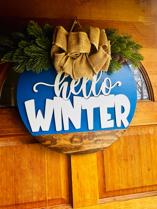 Hello Winter Door Hanger – 18” Round | Extra Thick 1” Wooden Winter Sign | Burlap Bow & Pine Décor